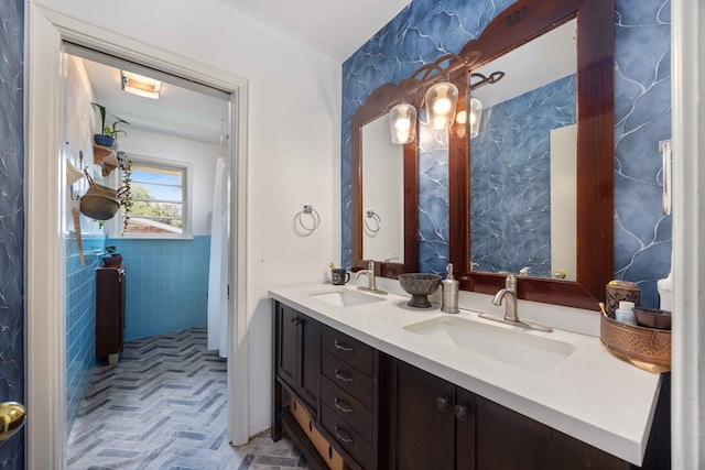 2618 Habersham Ave, Columbus, GA 31906 - bathroom featuring double vanity, tile walls, and brick patterned flooring