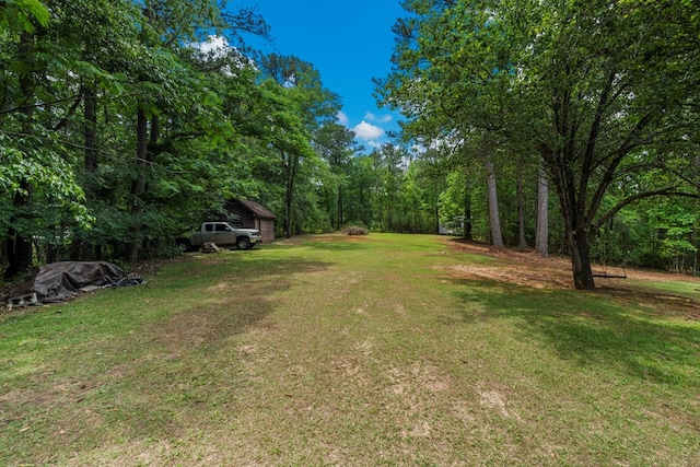view of yard featuring a view of trees