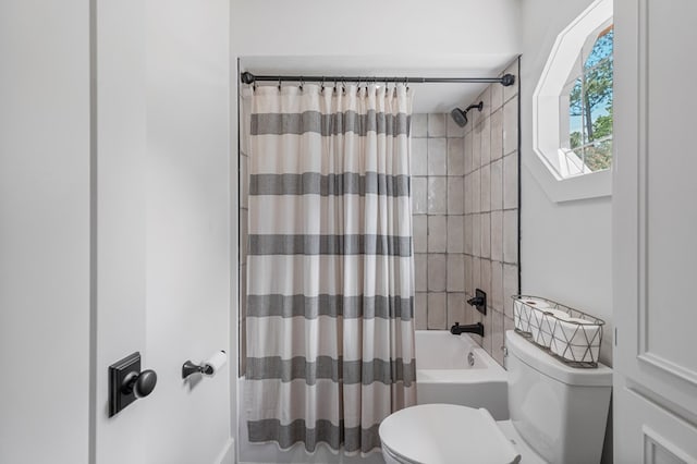 full bathroom with toilet and shower / bath combo with shower curtain
