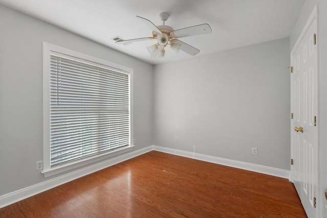 empty room featuring ceiling fan and hardwood / wood-style floors