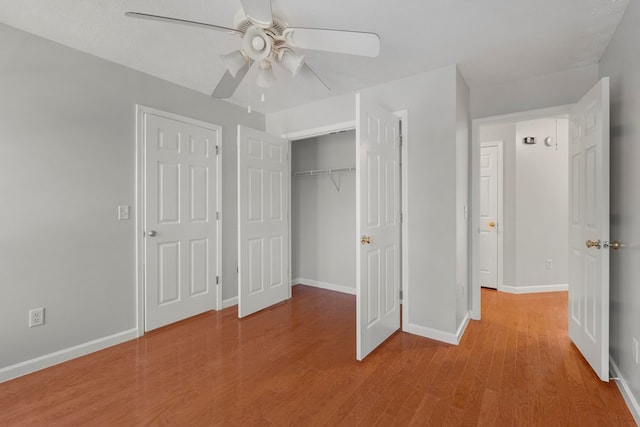 unfurnished bedroom featuring ceiling fan and light hardwood / wood-style floors