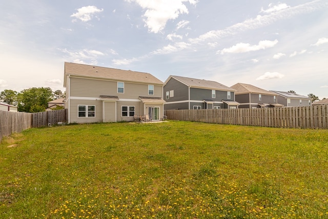 back of house featuring a residential view
