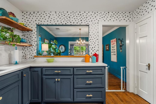 1445 22nd St, Columbus, GA 31901 - kitchen featuring open shelves, wood finished floors, crown molding, a chandelier, and light countertops