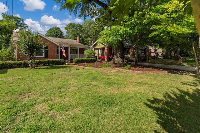 1445 22nd St, Columbus, GA 31901 - view of front of property with a front lawn, a chimney, and brick siding