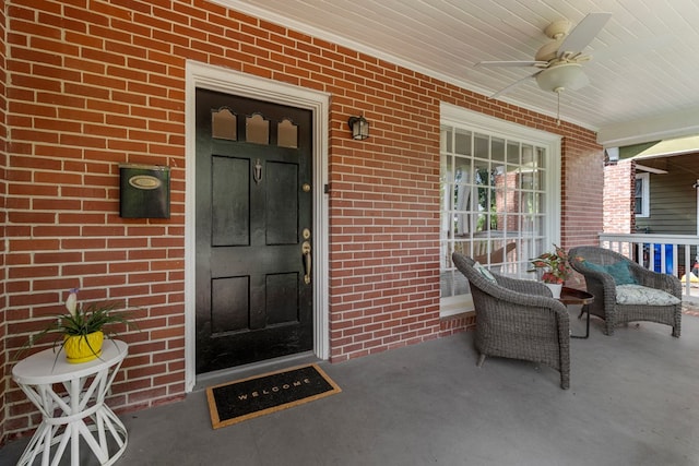 1445 22nd St, Columbus, GA 31901 - entrance to property featuring a porch, a ceiling fan, and brick siding