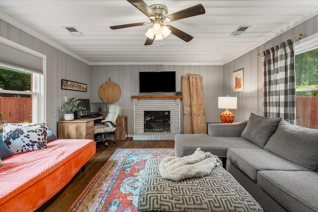 1445 22nd St, Columbus, GA 31901 - living room featuring dark wood finished floors, a desk, crown molding, a ceiling fan, and a fireplace