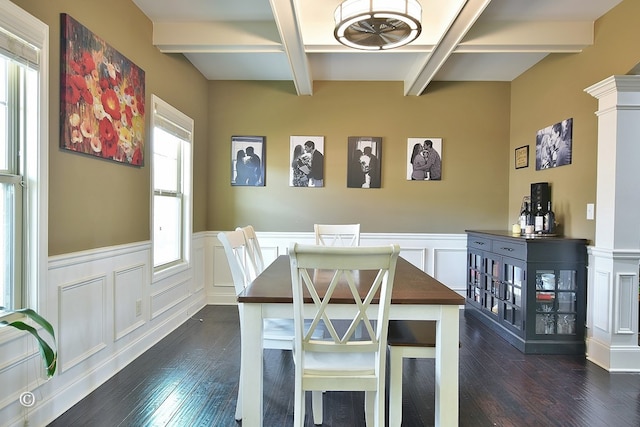 dining space with beamed ceiling and dark hardwood / wood-style floors