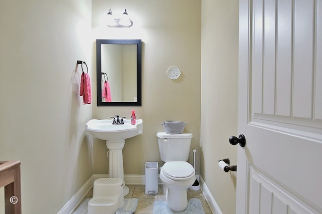 bathroom featuring tile patterned floors and toilet