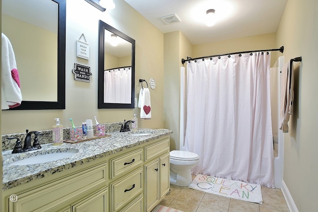 full bathroom with shower / bath combination with curtain, vanity, toilet, and tile patterned flooring