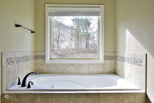 bathroom featuring tiled bath