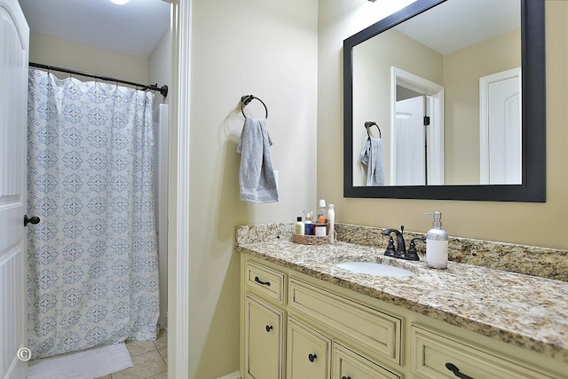 bathroom featuring tile patterned floors and vanity