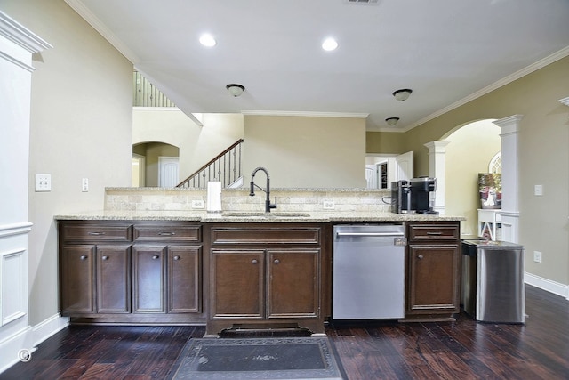 kitchen featuring dishwasher, light stone countertops, sink, and dark brown cabinetry