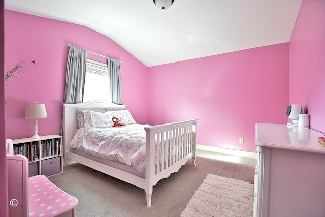 bedroom with vaulted ceiling and carpet