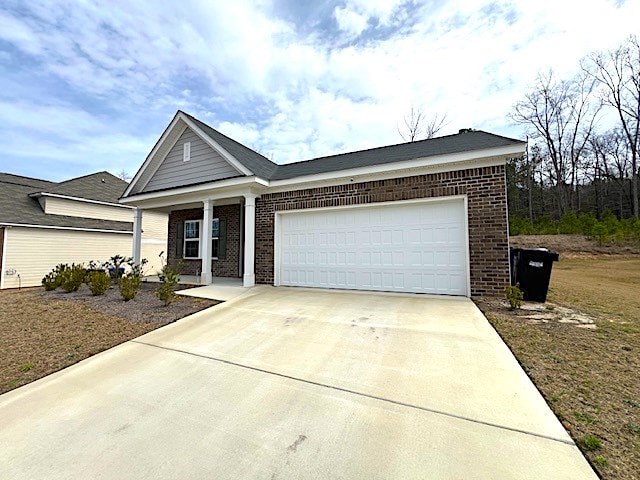 ranch-style home featuring concrete driveway, an attached garage, and brick siding