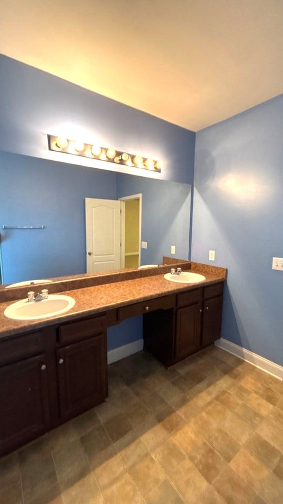 5 Rusty Dr, Phenix City, AL 36869 - bathroom with double vanity and baseboards