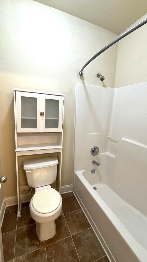 5 Rusty Dr, Phenix City, AL 36869 - full bath with toilet, tub / shower combination, tile patterned floors, and baseboards