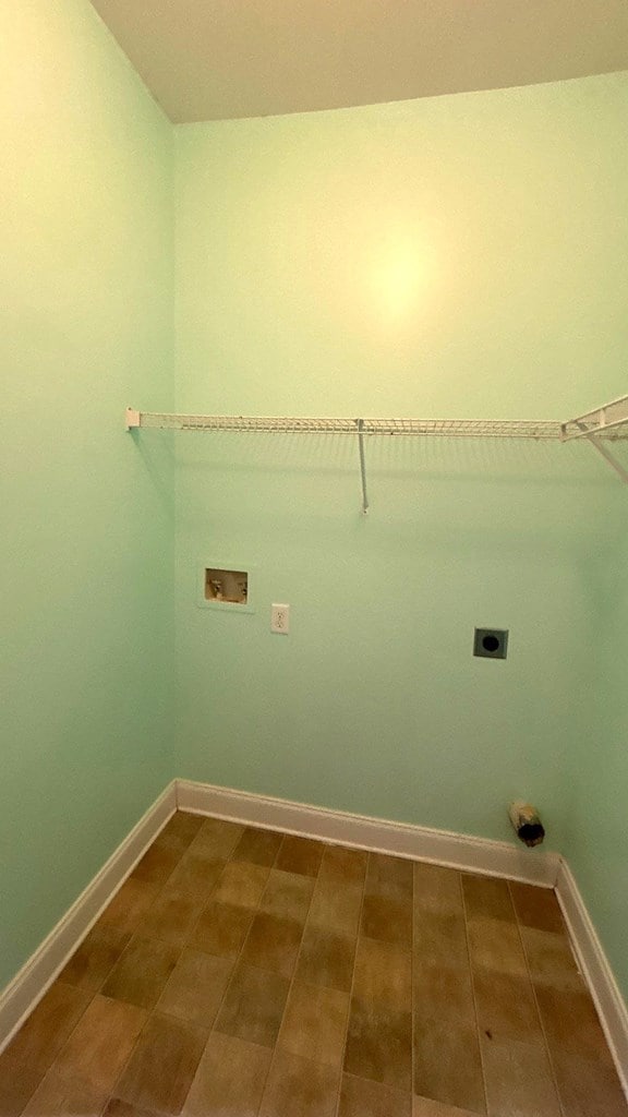 5 Rusty Dr, Phenix City, AL 36869 - laundry room featuring electric dryer hookup, hookup for a washing machine, and baseboards