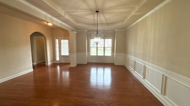 5 Rusty Dr, Phenix City, AL 36869 - unfurnished dining area with a raised ceiling, arched walkways, dark wood-style flooring, a decorative wall, and wainscoting