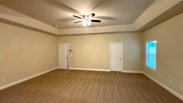 5 Rusty Dr, Phenix City, AL 36869 - unfurnished room featuring a tray ceiling, a ceiling fan, and carpet floors