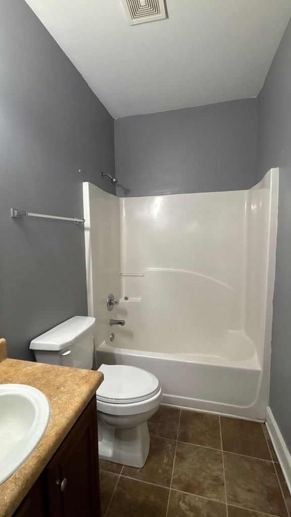 5 Rusty Dr, Phenix City, AL 36869 - bathroom with vanity, shower / tub combination, toilet, and baseboards