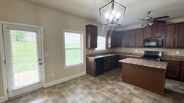5 Rusty Dr, Phenix City, AL 36869 - kitchen featuring black microwave, electric range oven, a sink, dark brown cabinetry, and baseboards