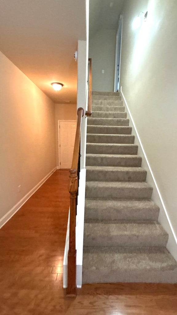 5 Rusty Dr, Phenix City, AL 36869 - stairway featuring wood finished floors and baseboards