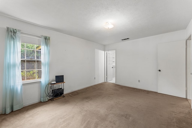 6256 Cricket Ln, Columbus, GA 31909 - carpeted empty room with a textured ceiling and baseboards