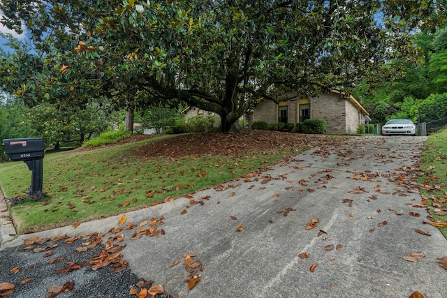 6256 Cricket Ln, Columbus, GA 31909 - view of property exterior featuring driveway and a yard