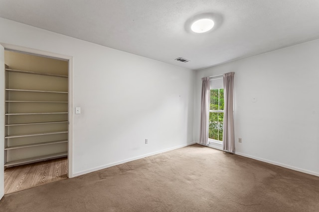 6256 Cricket Ln, Columbus, GA 31909 - unfurnished bedroom featuring carpet floors, baseboards, and a spacious closet