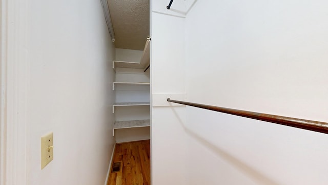 1225 Chaplin Dr, Columbus, GA 31904 - walk in closet with wood finished floors
