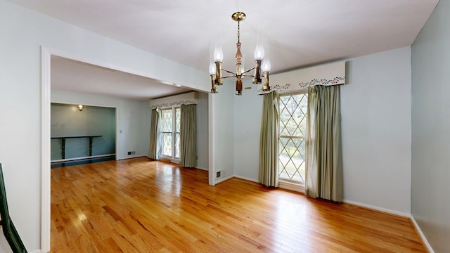 1225 Chaplin Dr, Columbus, GA 31904 - unfurnished room featuring a chandelier and light wood-style floors