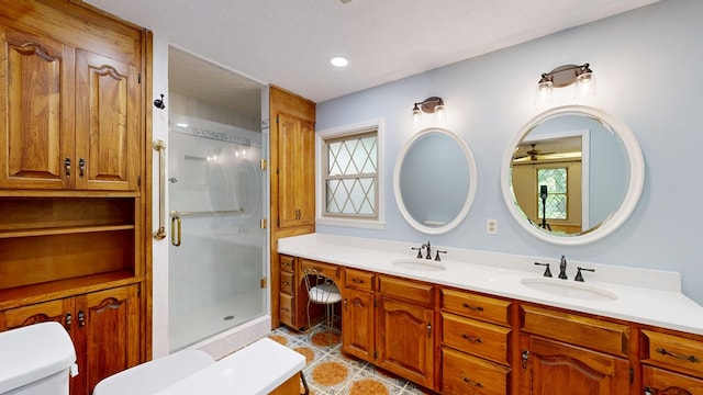 1225 Chaplin Dr, Columbus, GA 31904 - bathroom with double vanity, a shower stall, tile patterned floors, and ceiling fan
