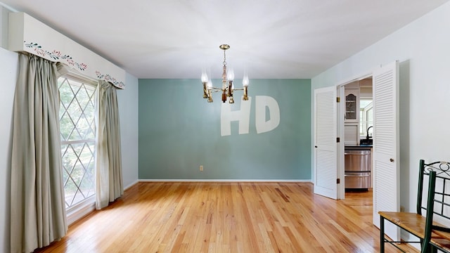 1225 Chaplin Dr, Columbus, GA 31904 - unfurnished room with a chandelier and light wood-style floors