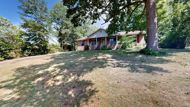 1225 Chaplin Dr, Columbus, GA 31904 - view of front facade featuring covered porch and a front lawn
