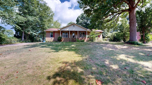 1225 Chaplin Dr, Columbus, GA 31904 - single story home featuring a porch, a front lawn, and brick siding
