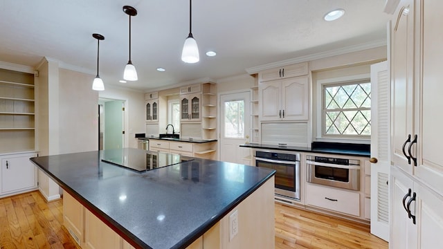1225 Chaplin Dr, Columbus, GA 31904 - kitchen featuring oven, open shelves, dark countertops, black electric cooktop, and a kitchen island
