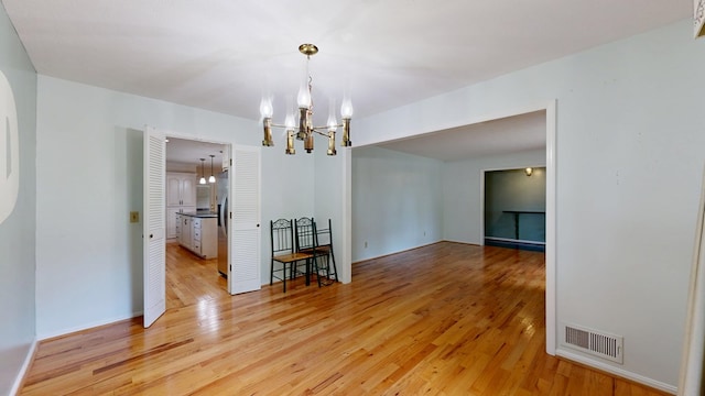 1225 Chaplin Dr, Columbus, GA 31904 - spare room featuring a chandelier and light wood-style flooring