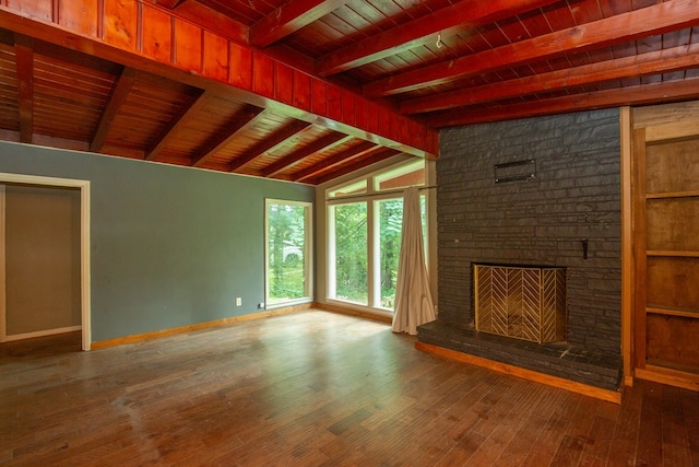 1609 4th Pl, Phenix City, AL 36869 - unfurnished living room with wooden ceiling, hardwood / wood-style floors, and a fireplace