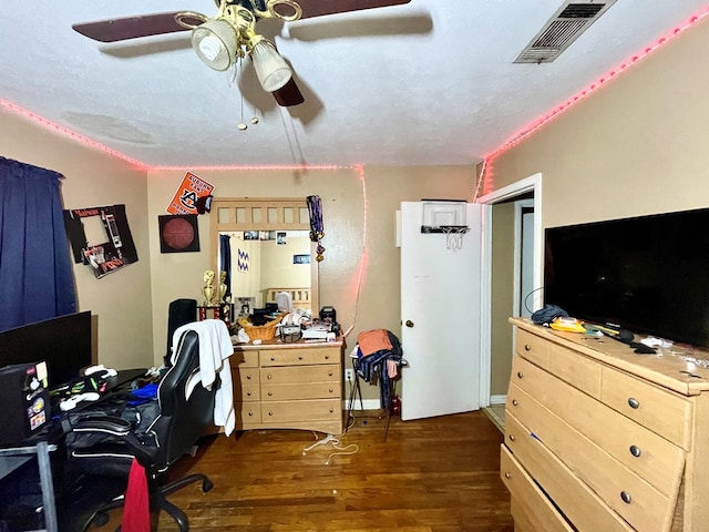 office area featuring ceiling fan and dark wood-type flooring