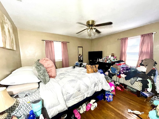 bedroom featuring hardwood / wood-style flooring and ceiling fan