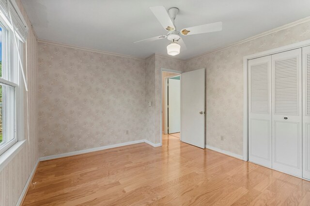 6248 Old Post Ct, Columbus, GA 31909 - unfurnished bedroom with wood finished floors, a closet, a ceiling fan, and crown molding