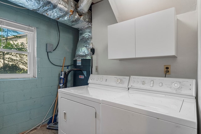 6248 Old Post Ct, Columbus, GA 31909 - laundry area with washer and dryer, concrete block wall, and cabinet space