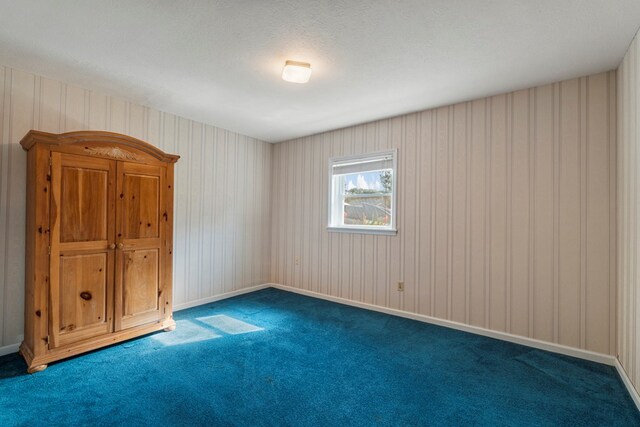 6248 Old Post Ct, Columbus, GA 31909 - carpeted empty room featuring wallpapered walls and a textured ceiling
