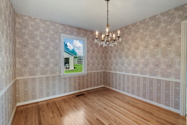 6248 Old Post Ct, Columbus, GA 31909 - spare room featuring hardwood / wood-style flooring and a chandelier