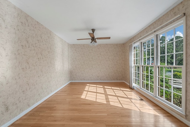 6248 Old Post Ct, Columbus, GA 31909 - spare room with wallpapered walls, light wood-type flooring, and ceiling fan