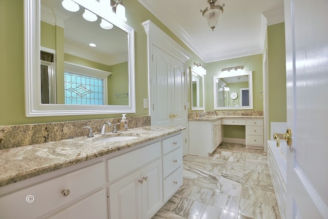 bathroom with crown molding and vanity