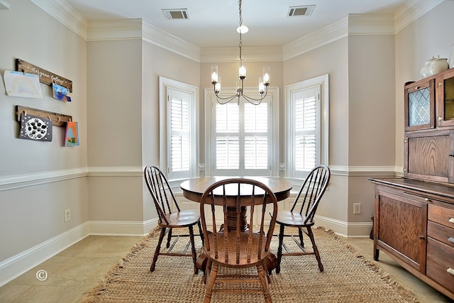 dining space featuring ornamental molding, a healthy amount of sunlight, and a notable chandelier