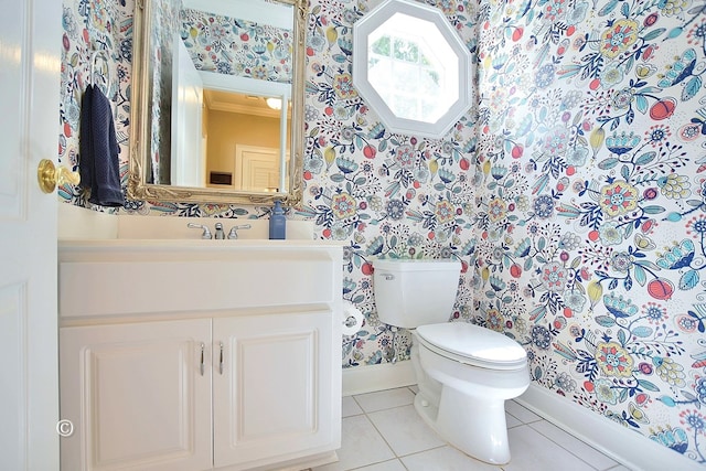 bathroom featuring tile patterned flooring, vanity, and toilet