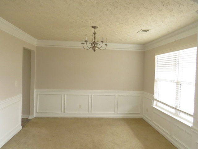 unfurnished dining area with visible vents, ornamental molding, a textured ceiling, light carpet, and a notable chandelier