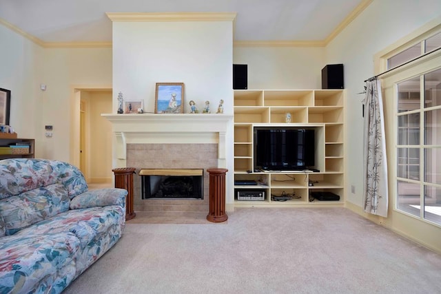carpeted living room with a tile fireplace and ornamental molding